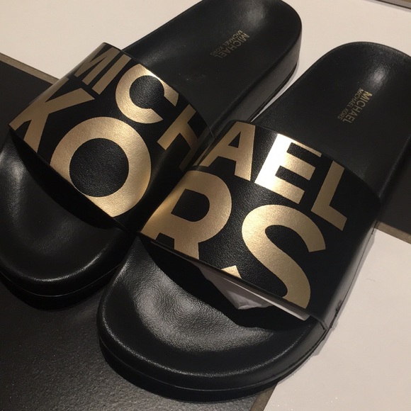 Michael Kors Shoes - 🖤⭐️Michael Kors gold and black slides⭐️🖤